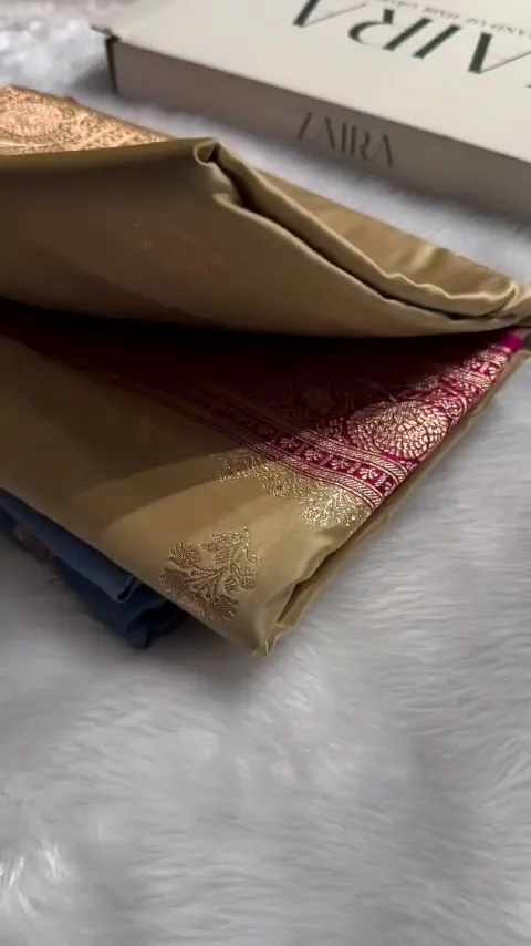 Video of the beige gold banarasi mashru silk butta saree showing the drape and zari