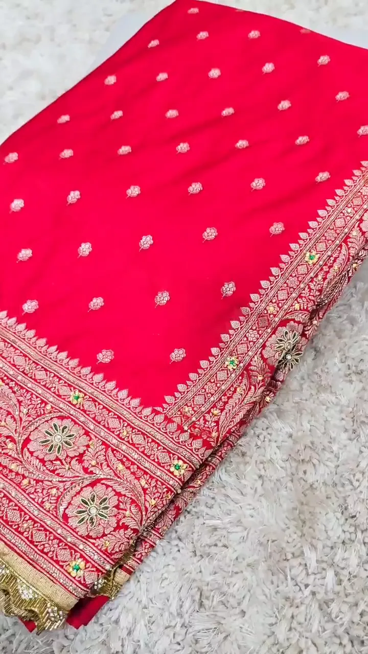 Video of the coral red banarasi mashru silk dardozi saree showing the drape and zari