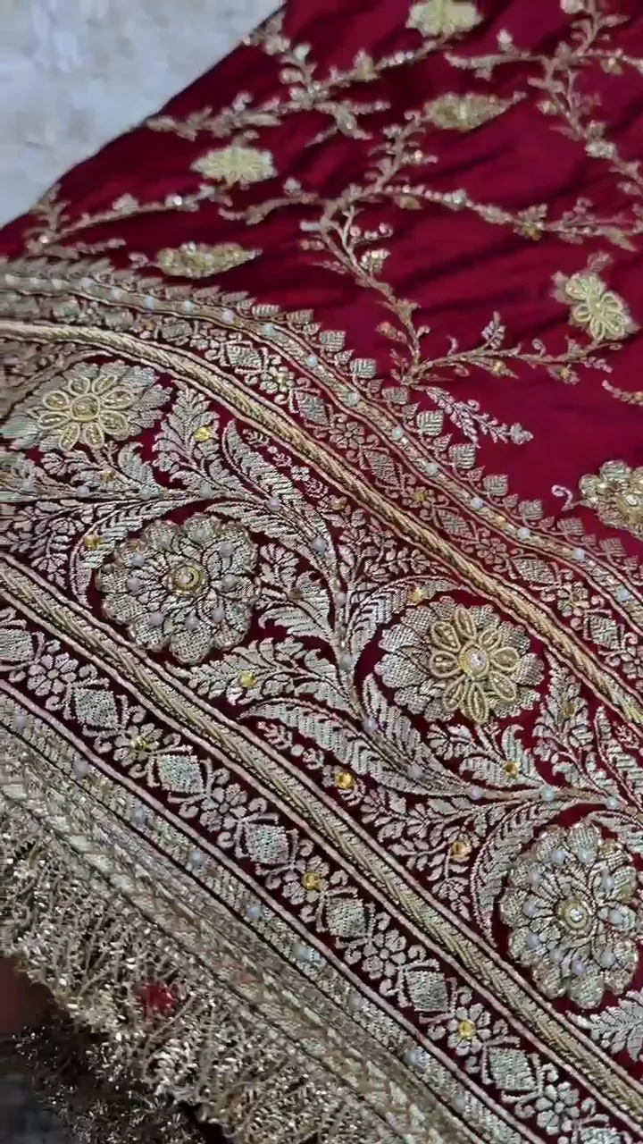Video of the maroon banarasi mashru silk dardozi saree showing the drape and zari